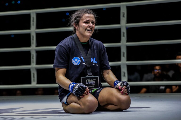 Eight-time Brazilian Jiu-Jitsu World Champion Michelle Nicolini wears the winner's medal following her win