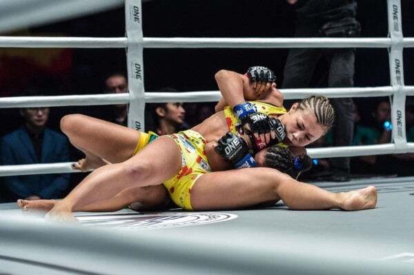 Japanese mixed martial artist Ayaka Miura tries to lock in an americana from the scarfhold position