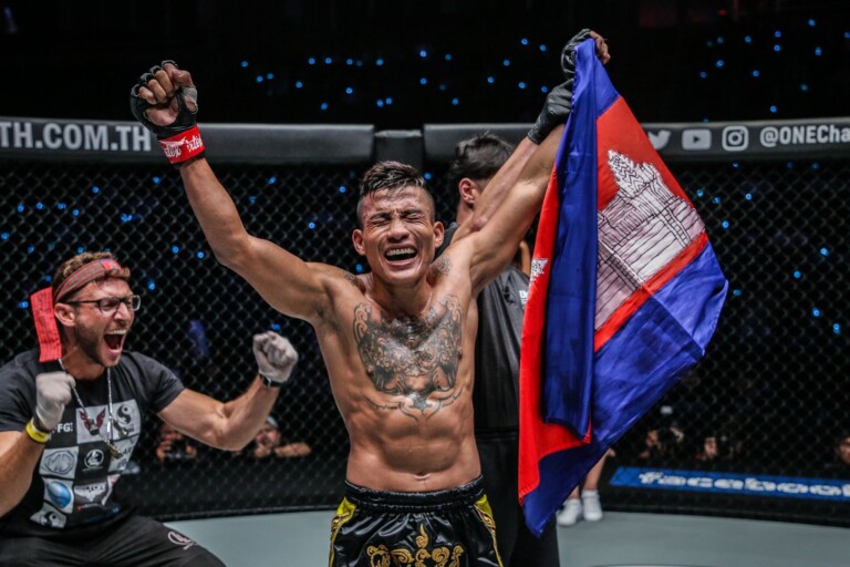 Chan Rothana poses with the Cambodian flag after his defeat of Gustavo Balart at ONE DREAMS OF GOLD