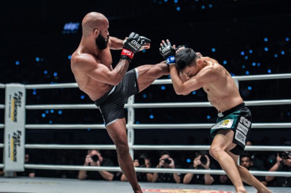 Flyweight legend Demetrious Johnson connects with a roundhouse on Tatsumitsu Wada
