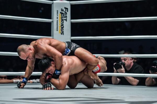 Eddie Alvarez fishes for the rear-naked choke on Eduard Folayang