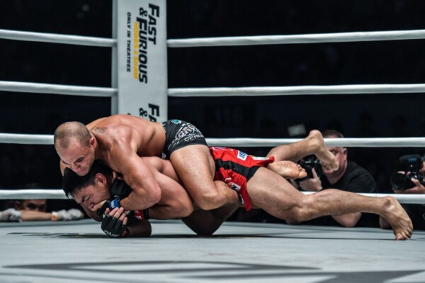 American star Eddie Alvarez sets up the rear-naked choke on Eduard Folayang