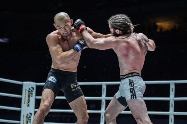 James Nakashima throws a left cross at Yushin Okami
