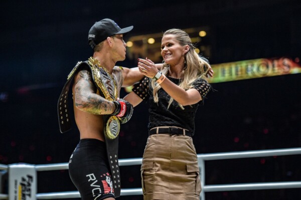 Martin Nguyen celebrates his win with his wife Brooke at ONE: DAWN OF HEROES.
