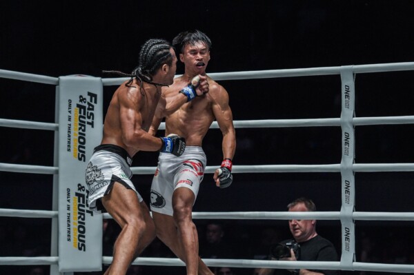Muhammad "Jungle Cat" Aiman scores with a big left hook at ONE: DAWN OF HEROES.