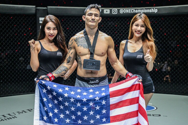 Vietnamese-American Thanh Le raises the stars and stripes following his knockout of Kotetsu Boku