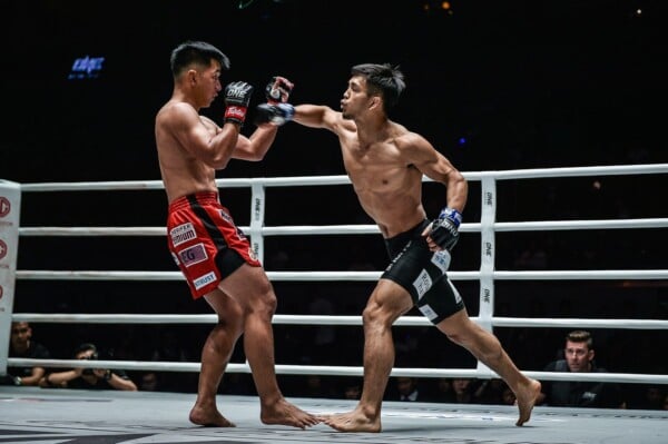 Japanese rising martial arts star throws a cross at former ONE Flyweight World Champion Geje Eustaquio