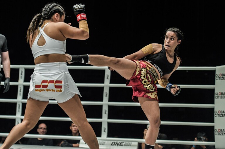 Indian mixed martial artist Puja Tomar throws a kick at Bi Nguyen