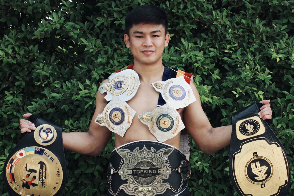 Sangmanee Sathian MuayThai poses with his World Title belts