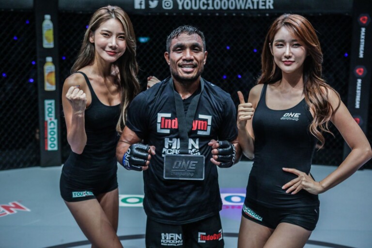 Indonesian mixed martial artist Abro Fernandes wears the winner's medal
