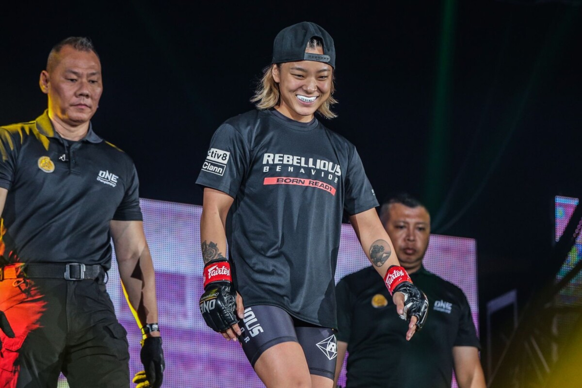 Japanese mixed martial artist Itsuki Hirata smiles with her mouthguard showing