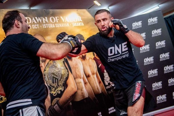 Kiamrian Abbasov hits pads at the ONE DAWN OF VALOR open workout