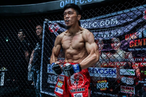 Filipino strawweight Lito Adiwang flexes before his match at ONE: CENTURY