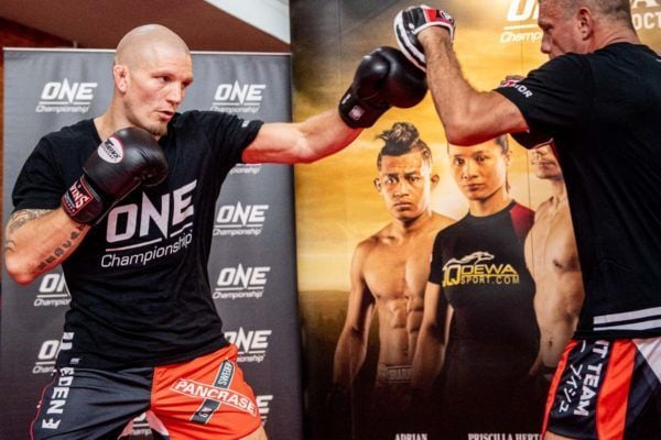 ONE Welterweight World Champion Zebaztian Kadestam at the ONE DAWN OF VALOR open workout with the ONE Championship belt