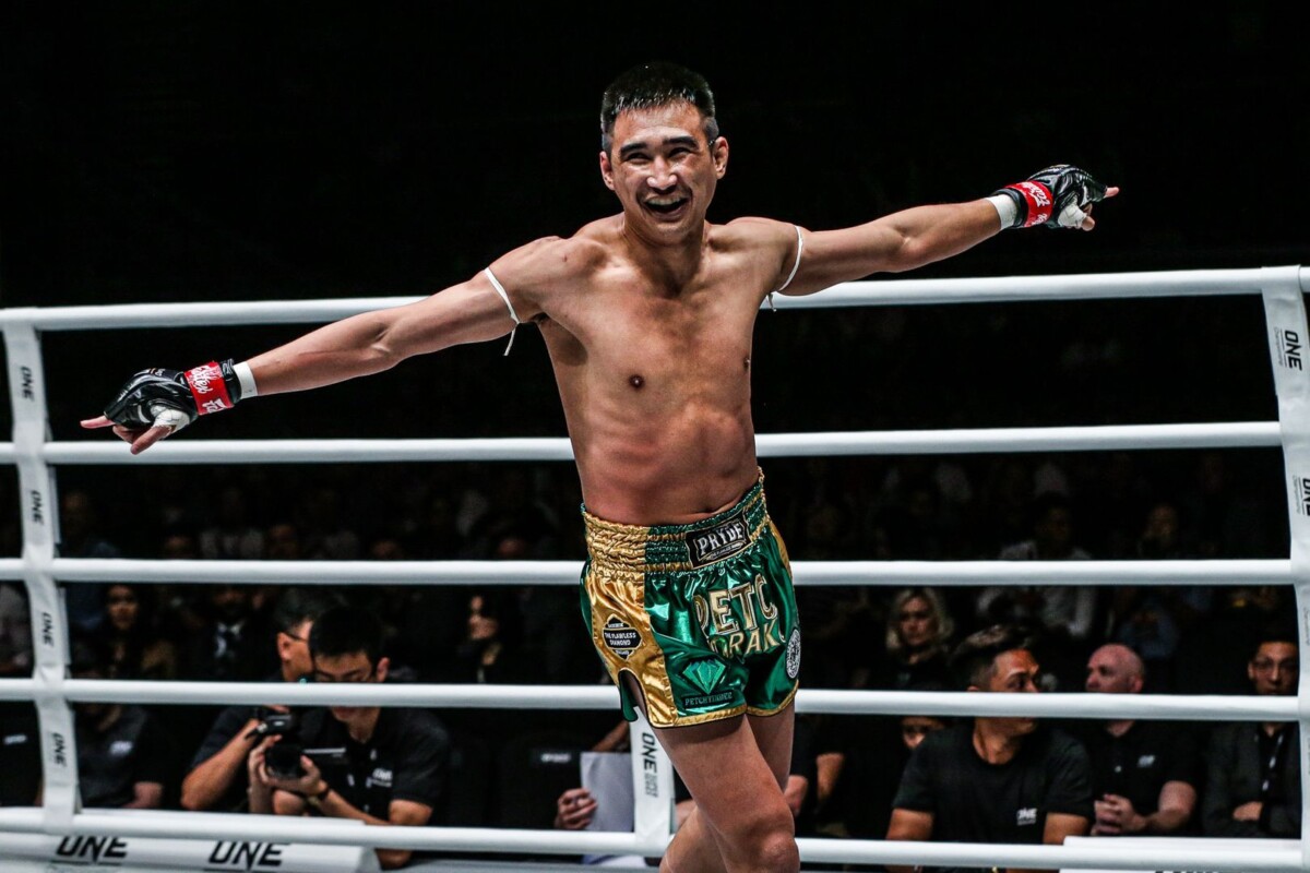 Thailand striker Petchmorakot Petchyindee Academy celebrates a victory