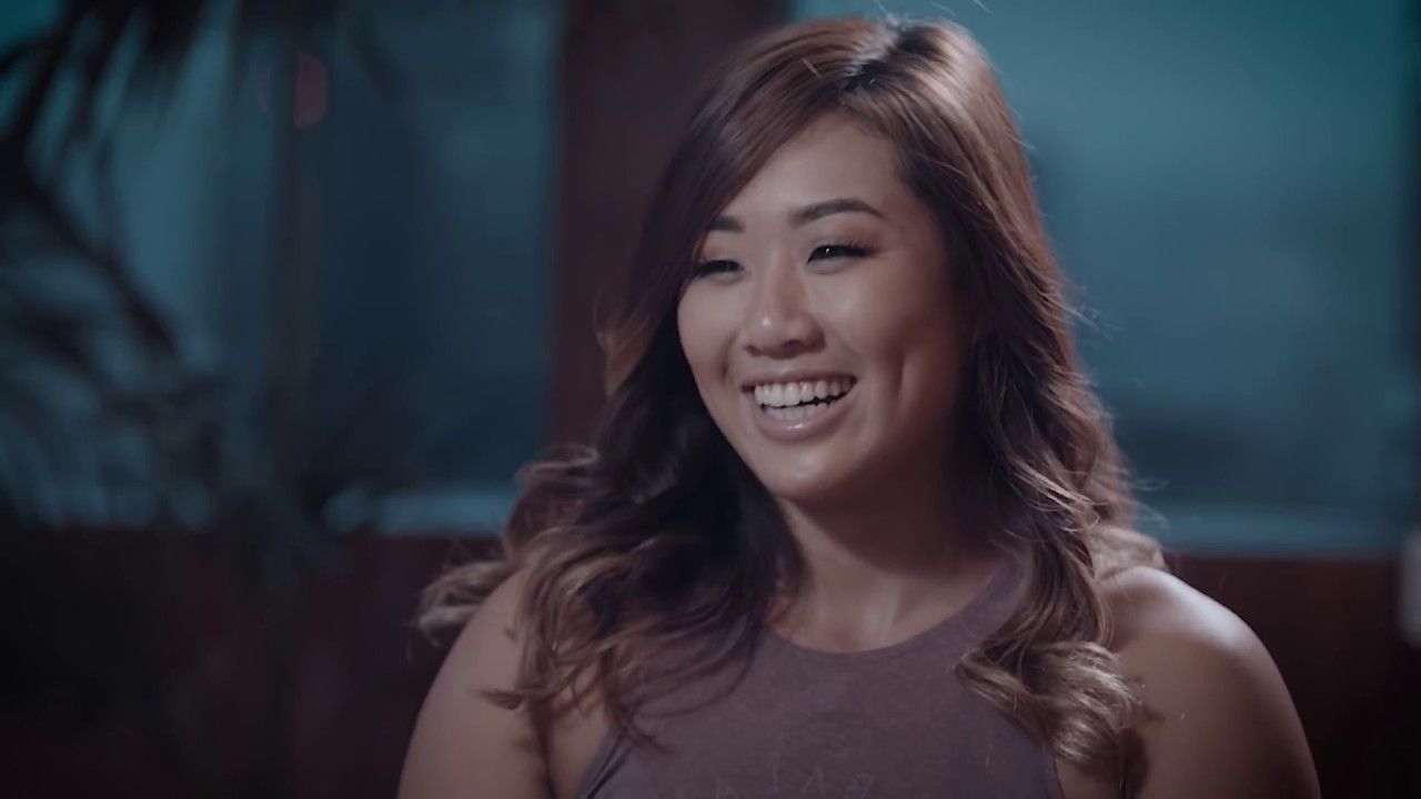 Angela Lee smiles in a sit-down interview.