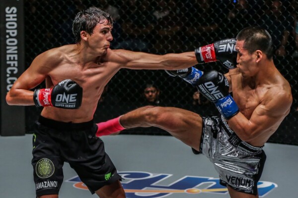 Russian striking ace Alaverdi Ramazanov exchanges shots with Chinese athlete Zhang Chenglong