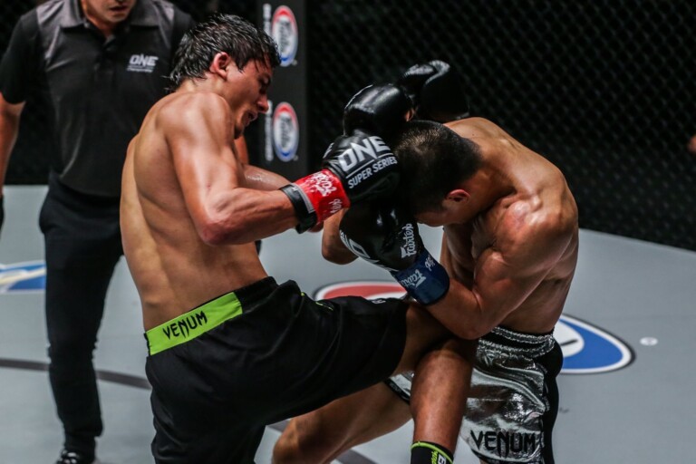 Russian striking ace Alaverdi Ramazanov exchanges shots with Chinese athlete Zhang Chenglong