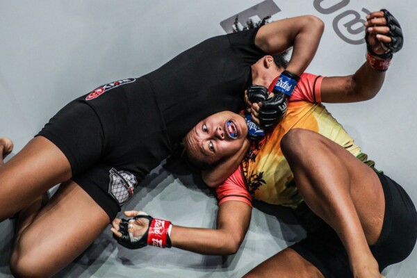 Brazilian Rayane Bastos secures a guillotine choke on Cambodian-American Sovannahry Em