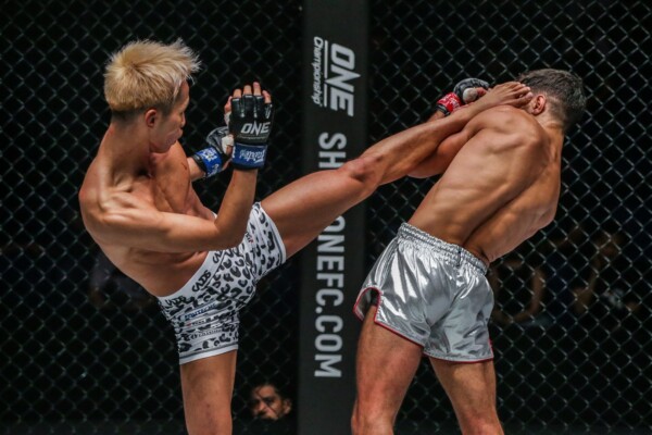 Japanese Muay Tha specialist Taiki Naito hits a high kick on Rui Botelho