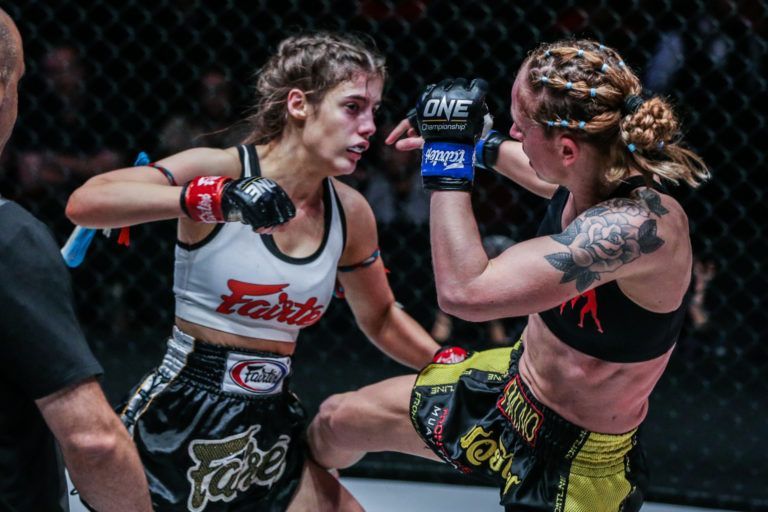 Australian Muay Thai striker Alma Juniku kicks Anne Line Hogstad