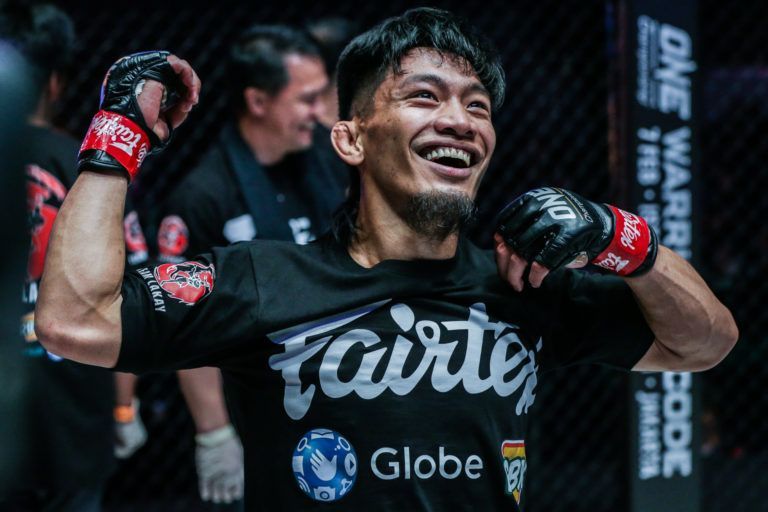Team Lakay's Lito Adiwang celebrates his victory over Pongsiri Mitsatit