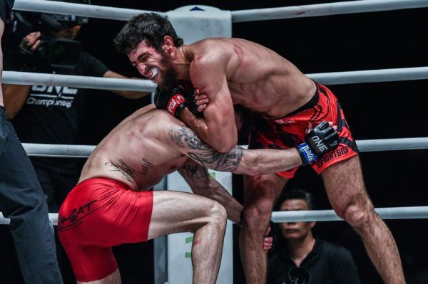 Dagestani mixed martial artist Raimond Magomedaliev sinks in the guillotine choke
