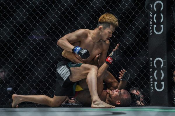 Japanese mixed martial artist Tatsumitsu Wada attacks Ivanildo Delfino on the ground
