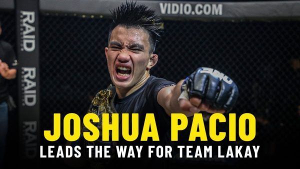 Filipino star and ONE Strawweight World Champion Joshua Pacio poses with the gold after a hard fought victory.