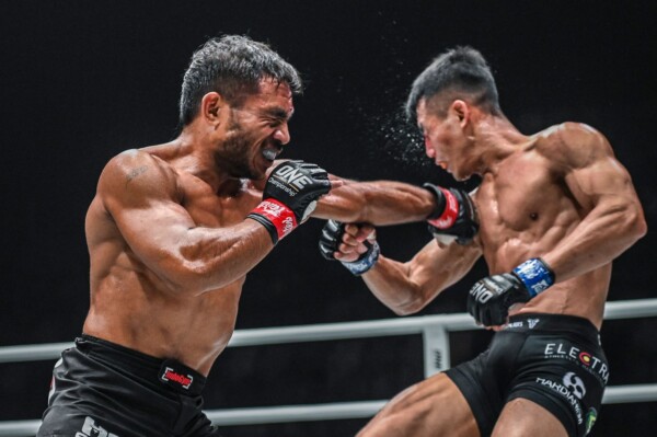 Indonesian flyweight Abro Fernandes punches his compatriot, Eko Priandono, in Jakarta