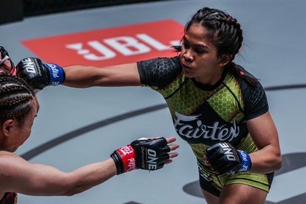 Philippine mixed martial artist stretches for the punch