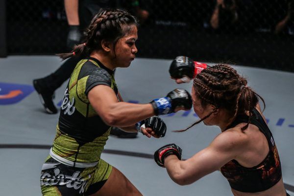 Unbeaten Filipina Denice Zamboanga hits Mei Yamaguchi with a cross