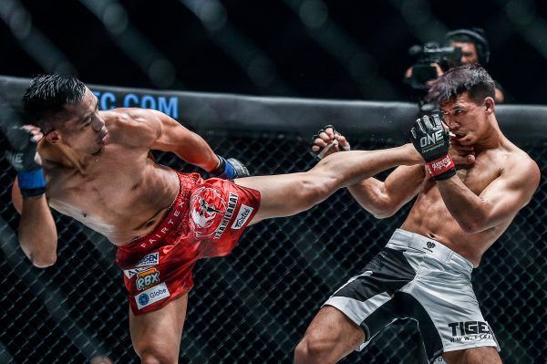 Team Lakay's Honorio Banario connects with a side kick on Thai mixed martial arts pioneerShannon Wiratchai