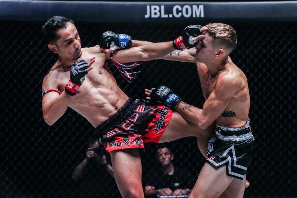 Sam-A Gaiyanghadao exchanges strikes with Rocky Ogden at ONE KING OF THE JUNGLE