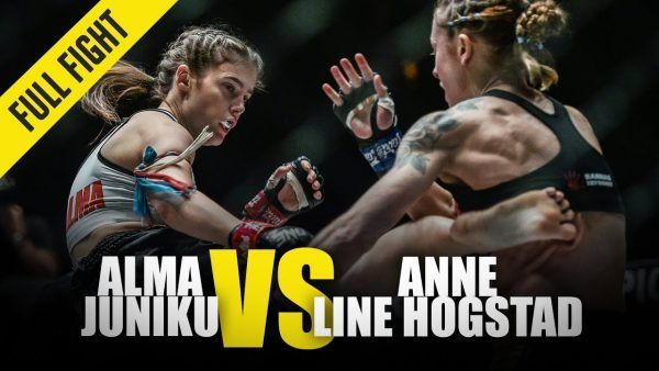 Aussie Alma Juniku lands a kick to the body of Norway's Anne Line Hogstad at ONE: FIRE & FURY.