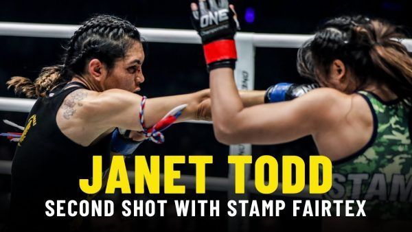 American Janet Todd fires a right hand toward Stamp Fairtex in their first meeting.