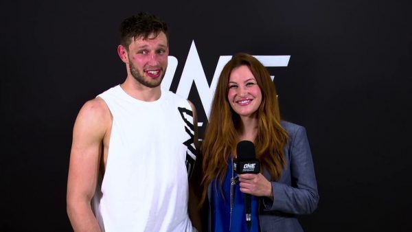 Miesha Tate speaks with co-main event victor Reinier De Ridder after his unanimous decision win over Leandro Ataides.