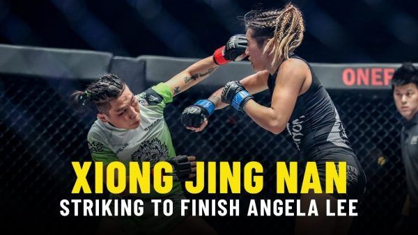 China's Xiong Jing Nan connects with an overhand right in a ONE Strawweight World Title defense at ONE: A NEW ERA.