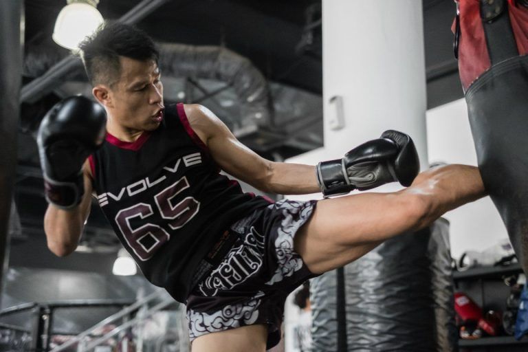 Multiple-time Muay Thai World Champion Sagetdao Petpayathai kicks a heavy bag at Evolve in Singapore