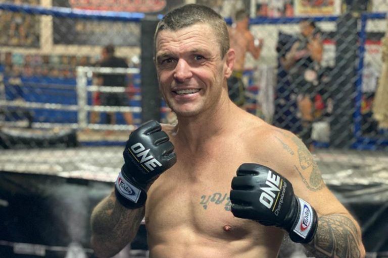 10-time Kickboxing and Muay Thai World Champion John Wayne Parr poses in his ONE Championship gloves
