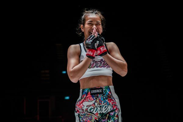 Muay Thai fighter Wondergirl Fairtex holds her hands together following her debut victory