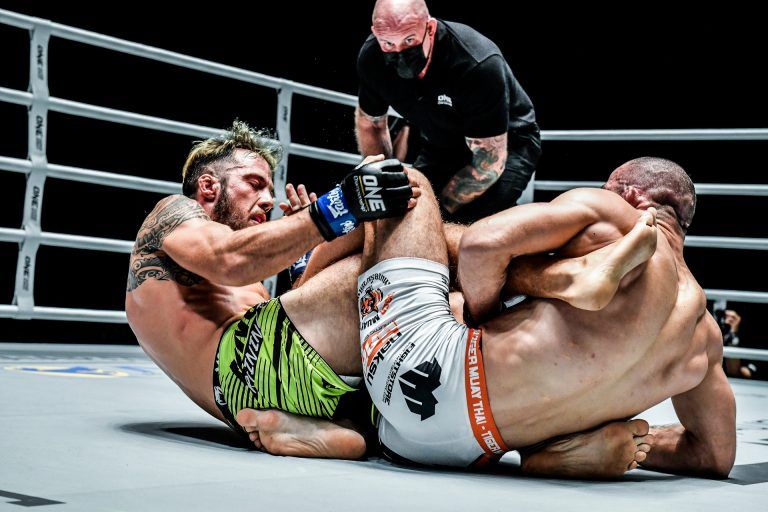 Russia's Abu Muslim Alikhanov goes for a leg lock