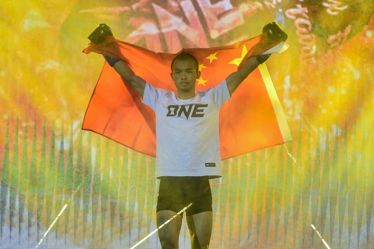 Former ONE World Title challenger Wang Junguang makes his way to the ring for a kickboxing match at ONE: INSIDE THE MATRIX IV