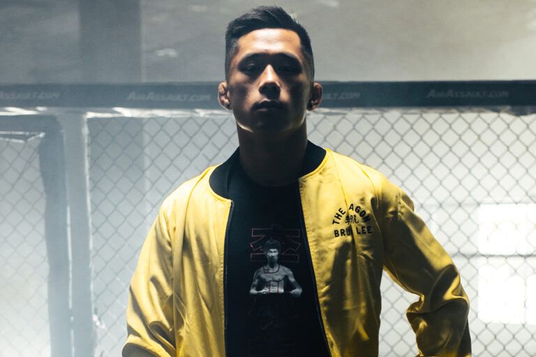 Martin Nguyen poses in the ONE x Bruce Lee Bomber Jacket