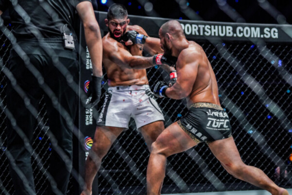 Japanese MMA fighter Hiroyuki Tetsuka punches Agilan Thani