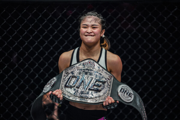 Stamp poses with the ONE Atomweight World Grand Prix title at ONE: WINTER WARRIORS.