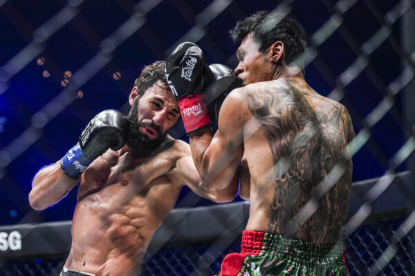 Chingiz Allazov connects on a clean punch to Jo Nattawut.