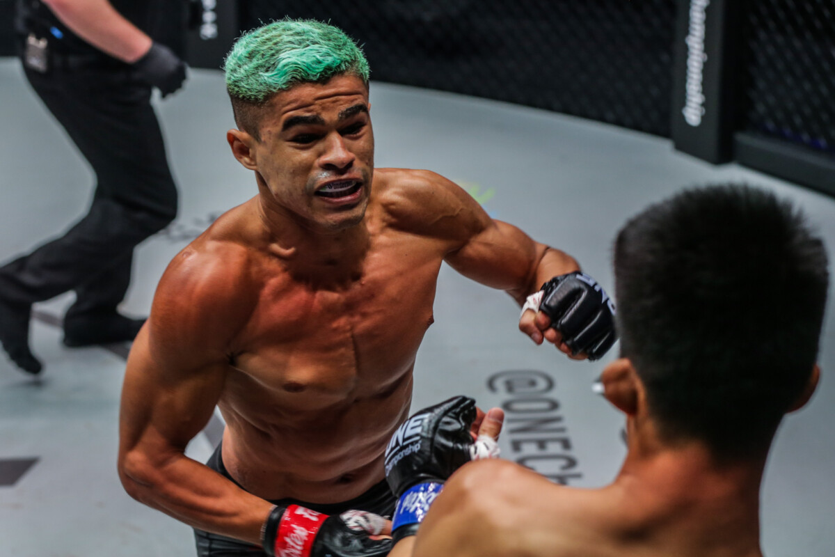 Brazilian MMA fighter Fabricio Andrade attacks Jeremy Pacatiw during their match at ONE: FULL CIRCLE