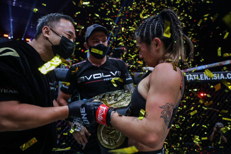 Angela Lee celebrates her successful defense of the ONE Atomweight World Championship with her husband Bruno Pucci and her father Ken Lee
