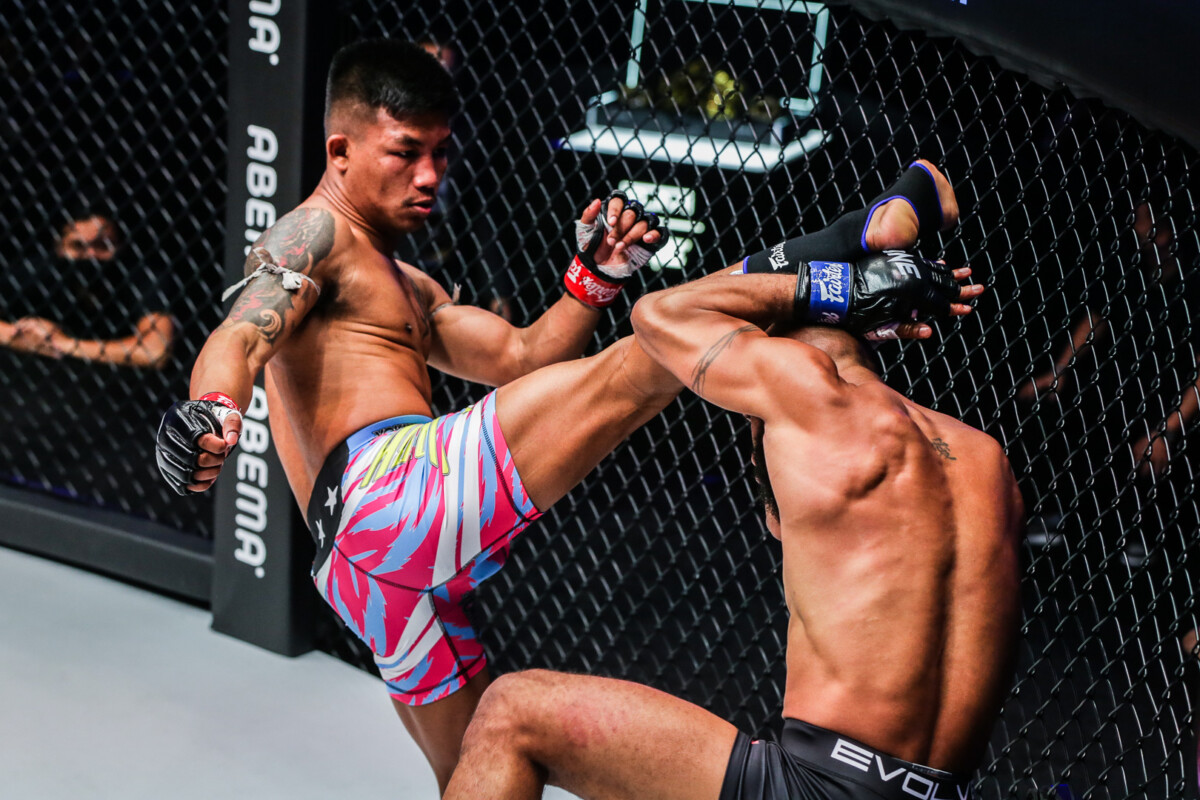Rodtang Jitmuangnon tags Demetrious Johnson with a kick to the head during their mixed rules superfight at ONE X